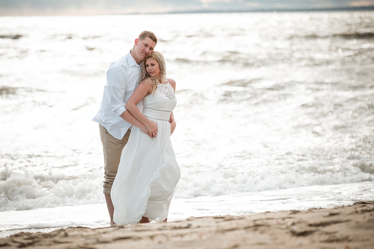 Engagement session with couple by water at Hammonasset Beach by Jamerlyn Brown Photography
